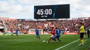 découvrez la durée exacte d'un match de football, ses différentes mi-temps, les arrêts de jeu et les possibilités de prolongation pour tout comprendre sur le temps de jeu.